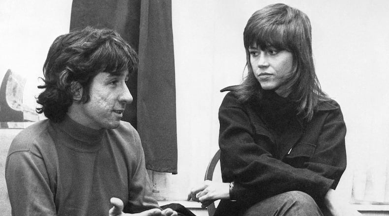 FILE - In this Dec. 26, 1972 file photo, actress Jane Fonda, right, and Tom Hayden, one of the founders of SDS, talk at the home of a friend in London, after their arrival from Paris. Hayden, the famed 1960s anti-war activist who moved beyond his notoriety as a Chicago 8 defendant to become a California legislator, author and lecturer, has died at age 76. His wife, Barbara Williams, says Hayden died on Sunday, Oct. 23, 2016, in Santa Monica of a long illness. (AP Photo, File)