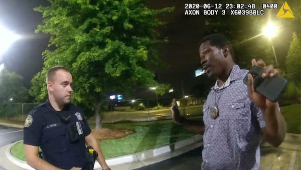 In this June 12, 2020, file photo from body camera video provided by the Atlanta Police Department, Rayshard Brooks speaks with Officer Garrett Rolfe in the parking lot of a Wendy's restaurant in Atlanta. (File/Atlanta Police Department via AP)