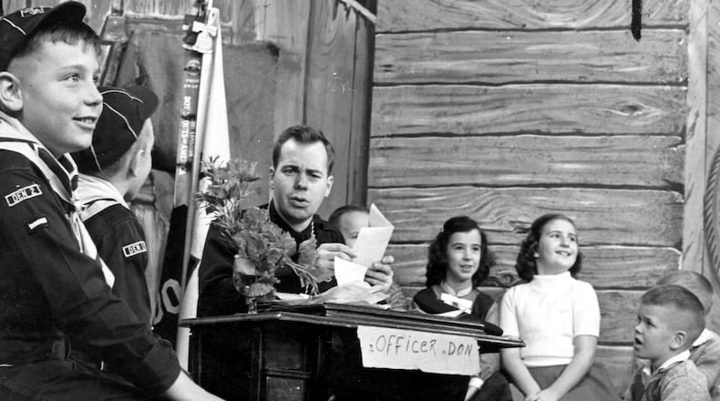 Don Kennedy in action with the "Gang." Kennedy's long broadcast career includes his stint as "Officer Don" on the Atlanta children's TV show "The Popeye Club," which ran from 1956-1970 on WSB, and his establishment of WKLS-FM, the former radio station 96 Rock.