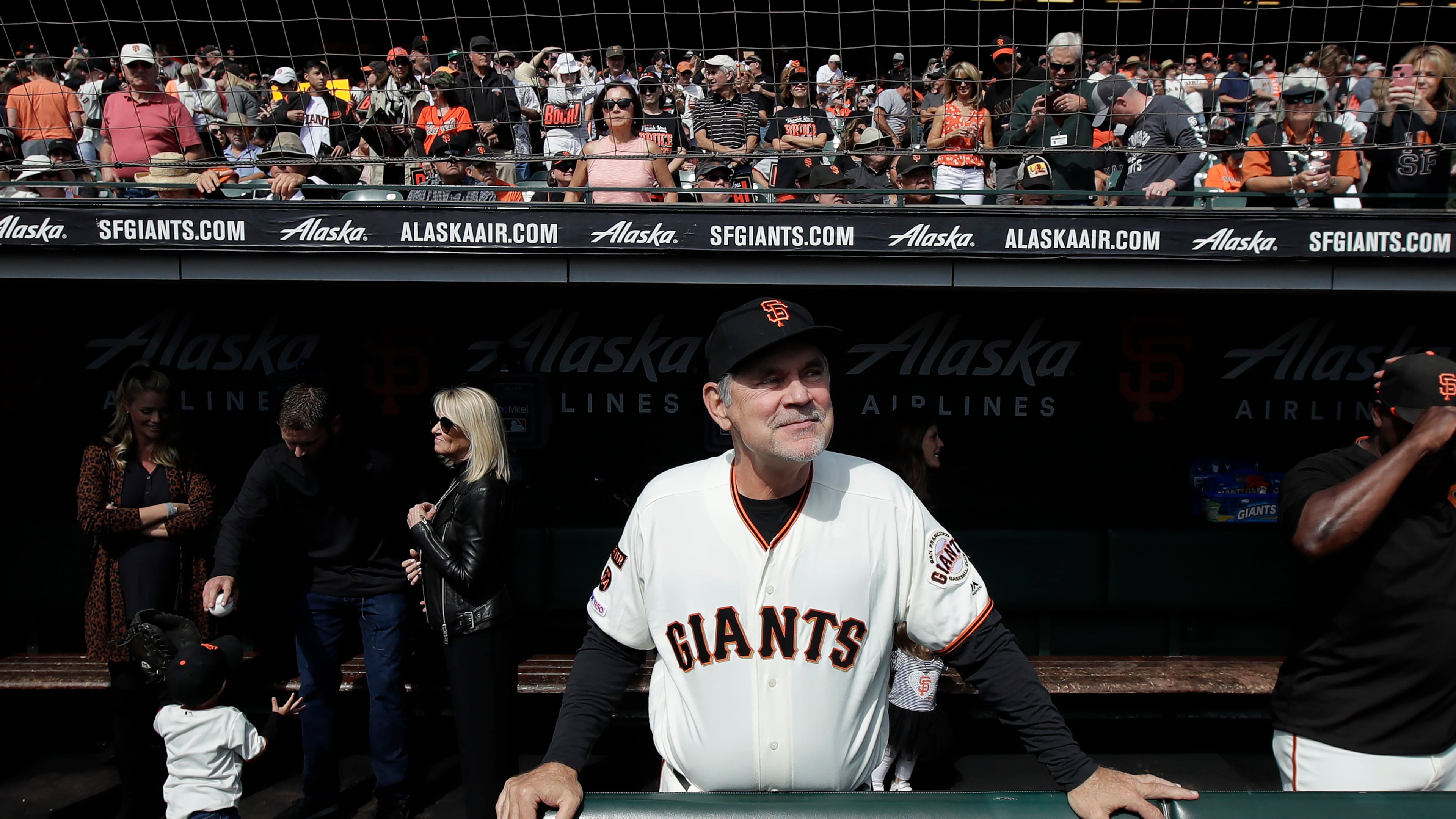 FILE - San Francisco Giants manager Bruce Bochy stands in the dugout before a baseball game between the Giants and the Los Angeles Dodgers in San Francisco, Sept. 29, 2019. (AP Photo/Jeff Chiu, File)