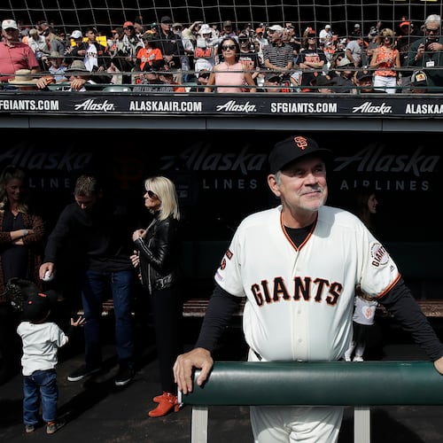 FILE - San Francisco Giants manager Bruce Bochy stands in the dugout before a baseball game between the Giants and the Los Angeles Dodgers in San Francisco, Sept. 29, 2019. (AP Photo/Jeff Chiu, File)