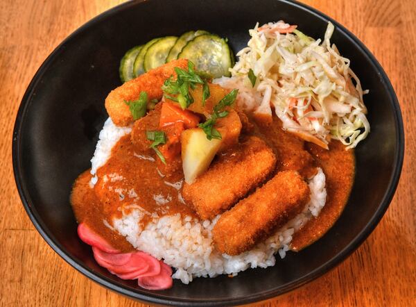 Curry Rice Bowl with Tenya fried tofu sticks, pickled red radish, sesame seeds and Japanese slaw. You also can get this dish with brined chicken tenders instead of the fried tofu. (Chris Hunt for The Atlanta Journal-Constitution)