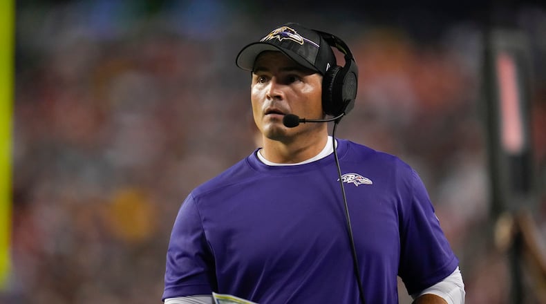 Baltimore Ravens defensive coordinator Mike Macdonald looks on during the first half of an NFL preseason football game between the Washington Commanders and the Baltimore Ravens, Monday, Aug. 21, 2023, in Landover, Md. The Commanders won 29-28. (AP Photo/Julio Cortez)