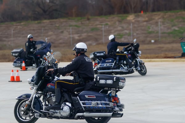 Members of the Atlanta Police Motorcycle Unit practice on a course during a media tour Tuesday, Dec. 17, 2024. (Miguel Martinez/AJC)