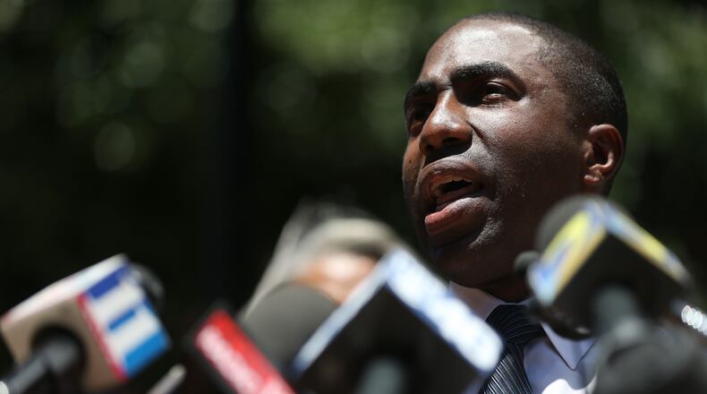 Interim DeKalb CEO Lee May hired investigators to root out corruption, then in a public falling out, told them to wrap up their work. BEN GRAY / BGRAY@AJC.COM