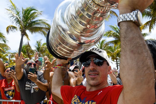 Florida Panthers Brad Marchand celebrates with fans during the NHL hockey team's Stanley Cup championship celebration, Sunday, June 22, 2025, in Fort Lauderdale, Fla (AP Photo/Michael Laughlin)