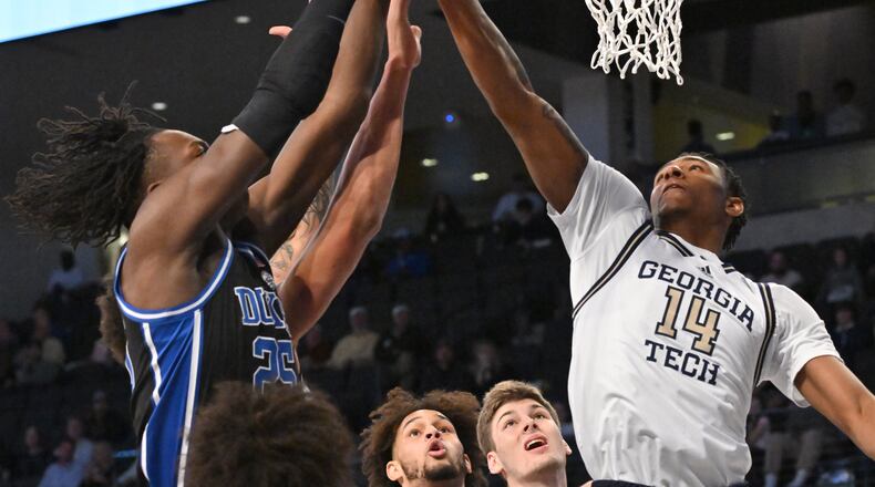 Duke’s forward Mark Mitchell (25) and Georgia Tech's forward Jalon Moore (14) fight for a rebound during the first half at Georgia Tech’s McCamish Pavilion, Saturday, Jan. 28, 2023, in Atlanta. (Hyosub Shin / Hyosub.Shin@ajc.com)