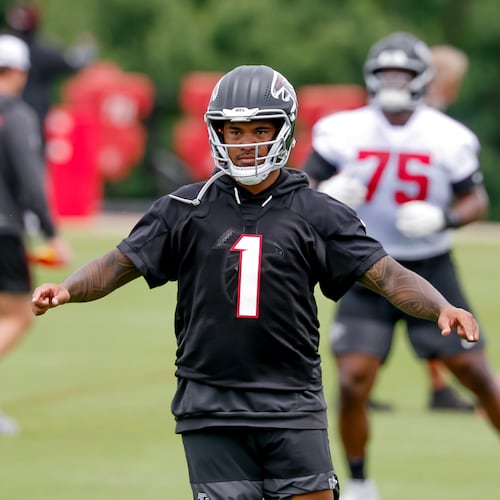 Quarterback Tua Tagovailoa is dealing with a back injury and won’t participate in the team’s first training camp practice Wednesday in Flowery Branch. (Erik S. Lesser for the AJC)