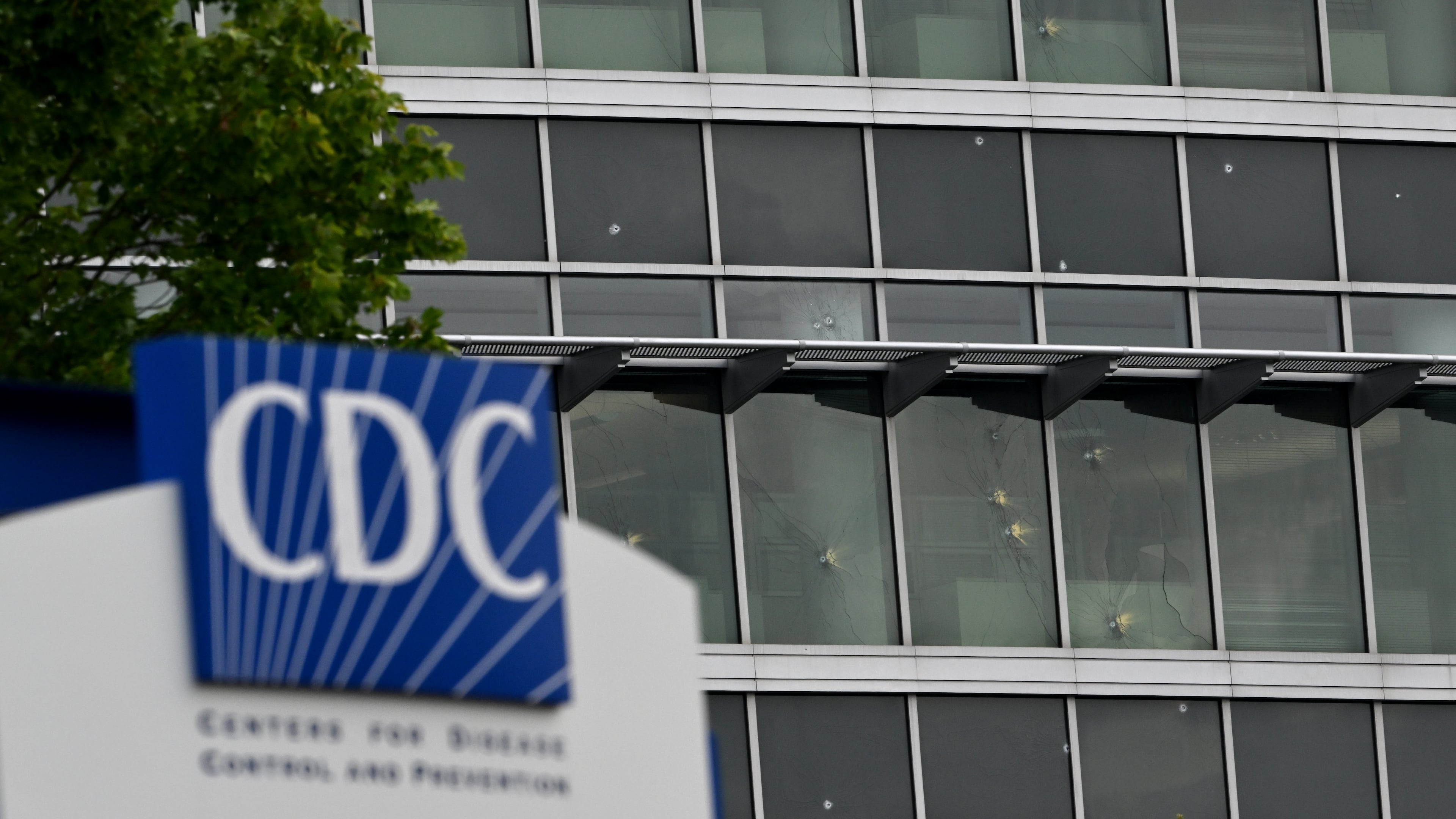 Bullet holes are visible in a CDC building on Saturday, August 9, 2025, after a deadly shooting Friday. A man opened fire on the Centers for Disease Control and Prevention on Friday, killing a police officer who tried to stop him, authorities said. (Hyosub Shin / AJC)