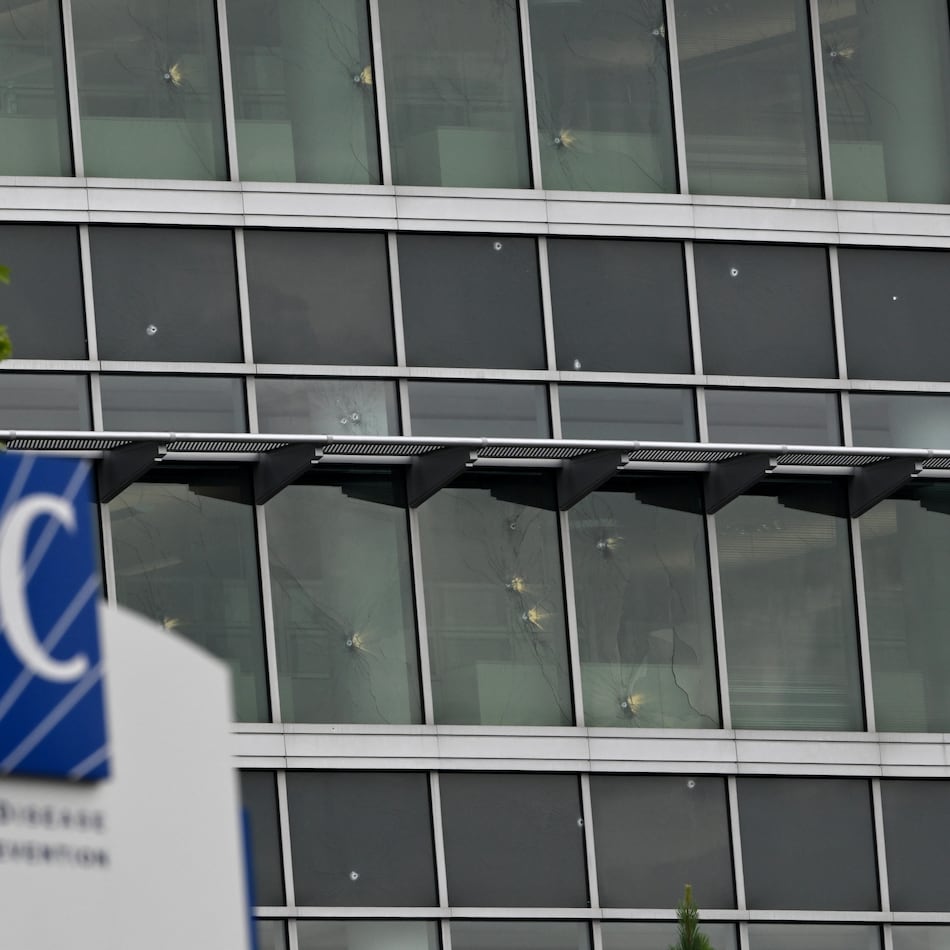 Bullet holes are visible in a CDC building on Saturday, August 9, 2025, after a deadly shooting Friday. A man opened fire on the Centers for Disease Control and Prevention on Friday, killing a police officer who tried to stop him, authorities said. (Hyosub Shin / AJC)
