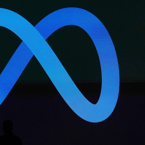 FILE - A Meta logo is shown on a video screen at LlamaCon 2025, an AI developer conference, in Menlo Park, Calif., April 29, 2025. (AP Photo/Jeff Chiu, File)