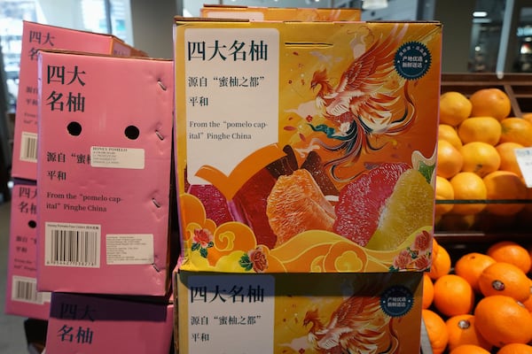 Pomelo citrus fruits imported from Pinghe County, China are sold at 99 Ranch Market, an Asian grocery store in Los Angeles Monday, April 7, 2025. (AP Photo/Damian Dovarganes)