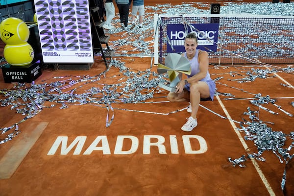 Aryna Sabalenka of Belarus holds a trophy after winning the Madrid Open tennis final in Madrid, Spain, Saturday, May 3, 2025. (AP Photo/Jose Breton)
