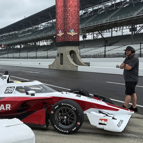 Reigning IndyCar champion Alex Palou drives into the pit lane to test a new IndyCar model, Sunday, Aug. 2, 2026, at Indianapolis Motor Speedway in Indianapolis. (AP Photo/Mike Marot)