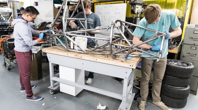 University of Pennsylvania students work on sanding rust off of the frame of their new car in the basement of the Towne Building on Saturday morning, March 17, 2018. (Sydney Schaefer/Philadelphia Inquirer/TNS)