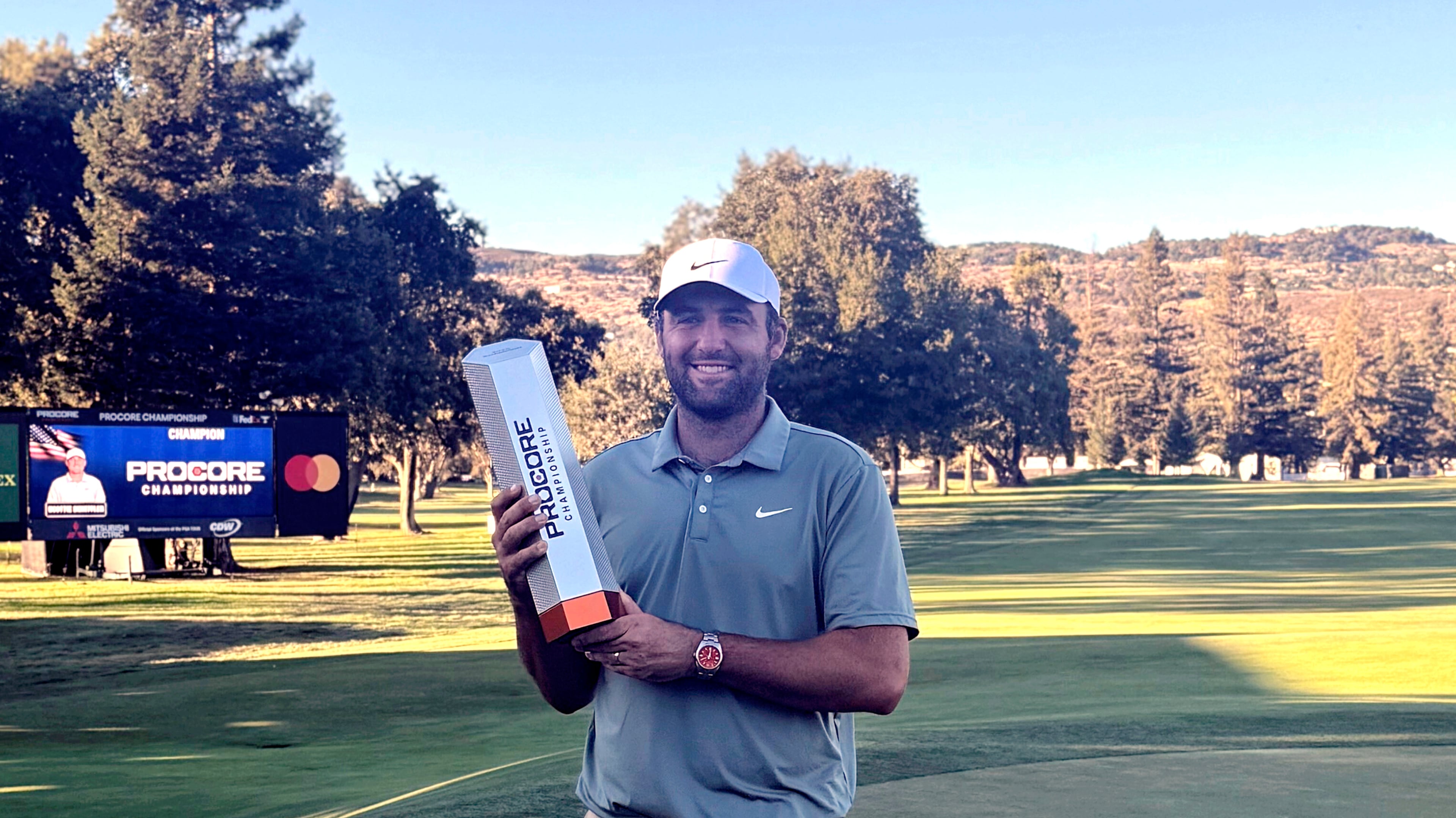 Scottie Scheffler holds the trophy after winning the Procore Championship on Sunday, Sept. 14, 2025, at Silverado Resort in Napa, California, for his sixth PGA Tour title of the year. (AP Photo/Doug Ferguson)