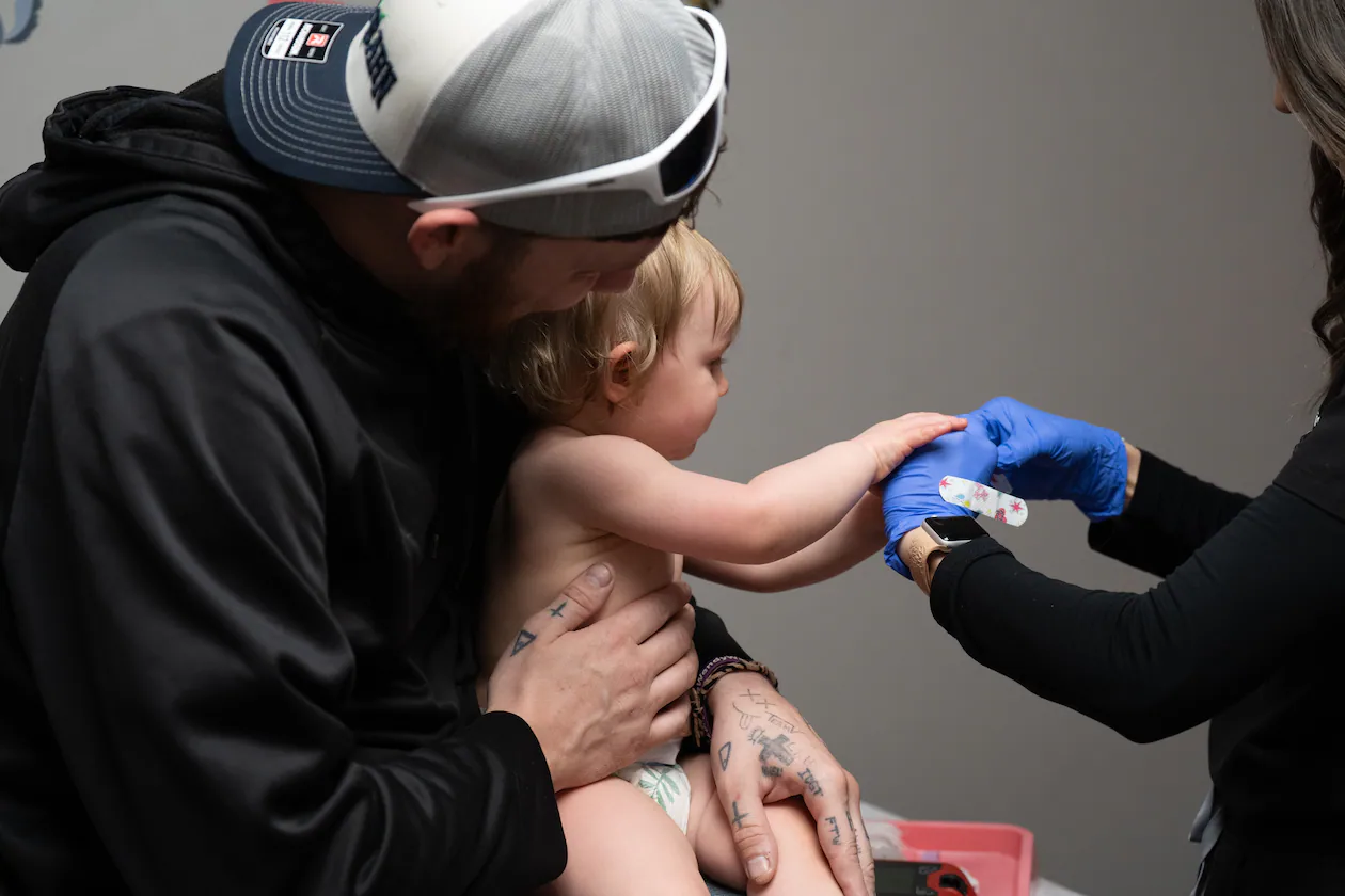 Daren Chandler's 12-month-old daughter has blood drawn before receiving a measles shot at Tiger Pediatrics in Easley, South Carolina on March 17, 2026. (Mary Conlon/AP)