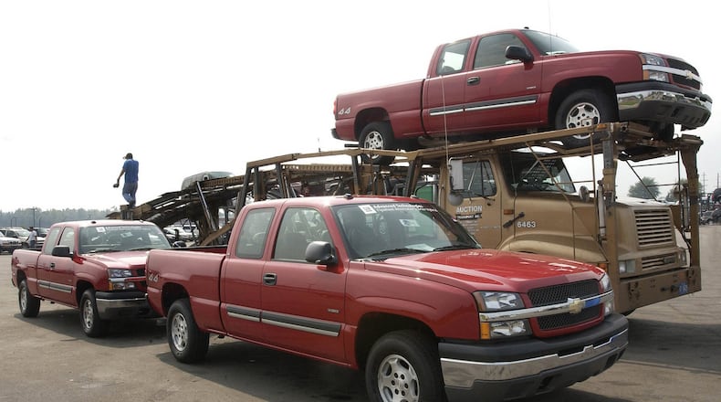 Trucks are loaded at Manheim’s Detroit Auto Auction in 2004. Manheim is part of Cox Automotive. (General Motors/Joe Polimeni)