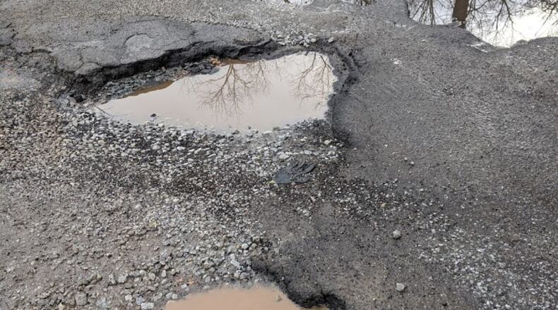 Tim Brotherton hopes these potholes can soon be fixed in Clarkston. Photo/Tim Brotherton.