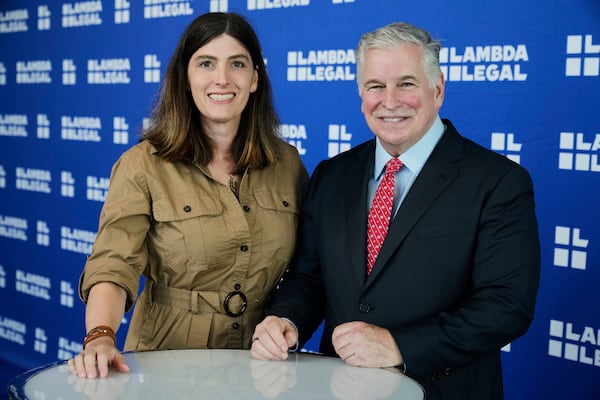 U.S. Navy Commander Emily Shilling, left, and Lambda Legal CEO Kevin Jennings pose for a photo before the Liberty Awards National Dinner, in New York, Thursday, June 5, 2025. (AP Photo/Richard Drew)