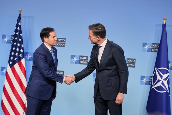 NATO Secretary General Mark Rutte, right, and United States Secretary of State Marco Rubio shake hands after addressing the media during a meeting of NATO foreign ministers at NATO headquarters in Brussels, Thursday, April 3, 2025. (AP Photo/Virginia Mayo)