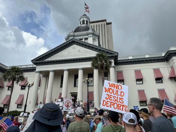 People gather on the grounds of Florida’s old capitol in Tallahassee, Fla., for “No Kings” protest on Saturday, June 14, 2025. (AP Photo/Kate Payne)