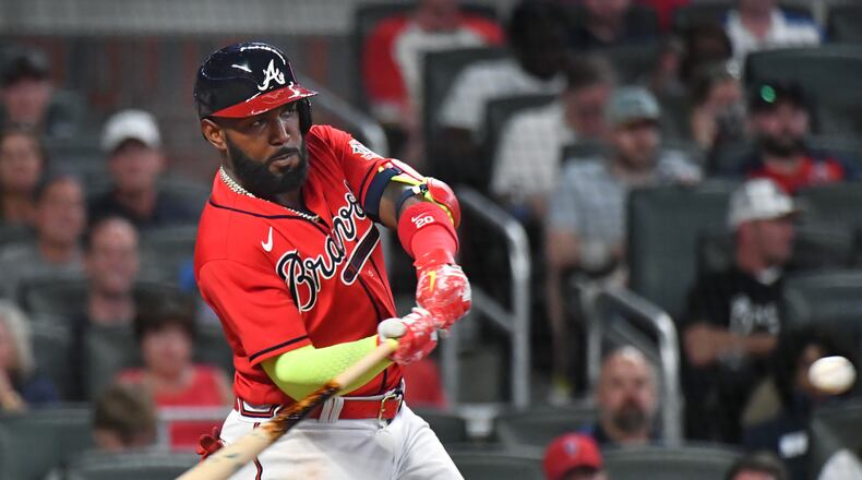 May 21, 2021 Atlanta - Atlanta Braves left fielder Marcell Ozuna (20) hits one run home run in the 6th inning at Truist Park on Friday, May 21, 2021. Atlanta Braves won 20-1 over Pittsburgh Pirates. (Hyosub Shin / Hyosub.Shin@ajc.com)