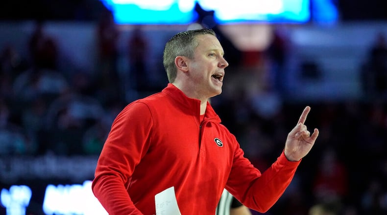 Georgia coach Mike White yells to his players on the court during the first half of an NCAA college basketball game against Auburn Wednesday, Jan. 4, 2023, in Athens, Ga. (AP Photo/John Bazemore)