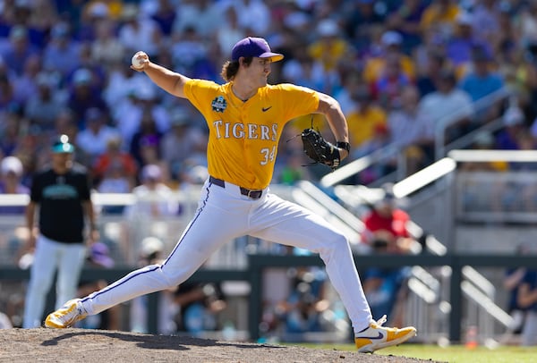 LSU's Chase Shores pitches against Coastal Carolina in the seventh inning of Game 2 of the NCAA College World Series baseball finals in Omaha, Neb., Sunday, June 22, 2025. (AP Photo/Rebecca S. Gratz)