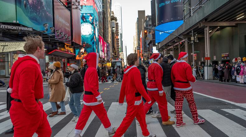 FILE - Revelers take part in SantaCon, Dec. 14, 2024, in New York. (AP Photo/Julia Demaree Nikhinson, File)