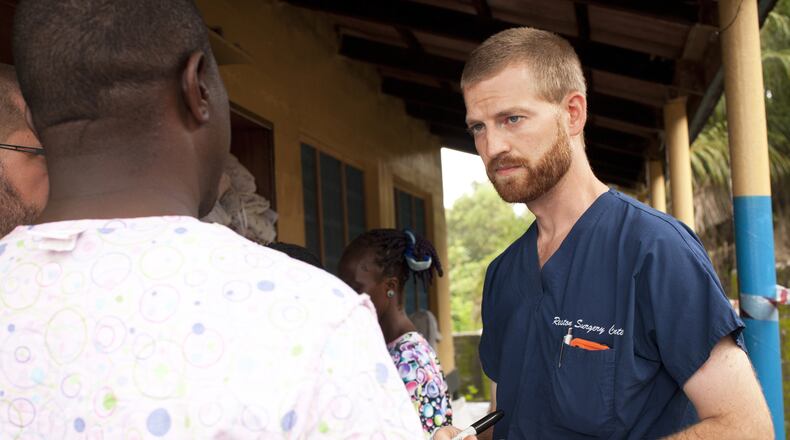MONROVIA, LIBERIA - UNSPECIFIED DATE:In this handout provided by Samaritan's Purse, Dr. Kent Brantly (R), one of the two Americans who contracted Ebola, works at an Ebola isolation ward at a mission hospital outside of Monrovia, Liberia. Brantly arrived on U.S. soil after contracting the deadly disease and is showing signs of improvement as he is treated at Emory University Hospital in Atlanta, Georgia. (Photo by Samaritans Purse via Getty Images)