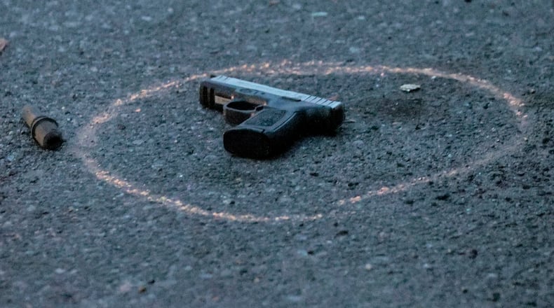One of several guns found on the street as police investigated a shooting near a West Philadelphia recreation center in August. (Steven M. Falk/The Philadelphia Inquirer/TNS)