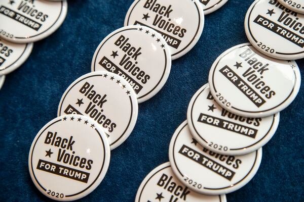 09/25/2020 - Atlanta, Georgia - Campaign pins are available for purchase before the start of a Blacks for Trump campaign rally at the Cobb Galleria Centre in Atlanta, Friday, September 25, 2020.  (Alyssa Pointer / Alyssa.Pointer@ajc.com)