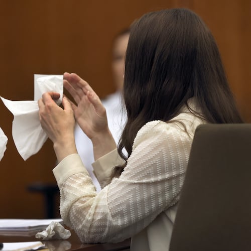 Lindsay Clancy grabs a tissue after witness Elaine Rossi, the nanny to the Clancy children, testified during her murder trial at Plymouth Superior Court in Plymouth, Mass., Wednesday, Aug. 5, 2026. (David L Ryan/The Boston Globe via AP, Pool) CORRECTION: Source is The Boston Globe, not The Boston Herald.