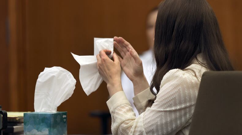Lindsay Clancy grabs a tissue after witness Elaine Rossi, the nanny to the Clancy children, testified during her murder trial at Plymouth Superior Court in Plymouth, Mass., Wednesday, Aug. 5, 2026. (David L Ryan/The Boston Globe via AP, Pool) CORRECTION: Source is The Boston Globe, not The Boston Herald.