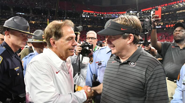 Alabama's head coach Nick Saban and Georgia's head coach Kirby Smart shake hands after Alabama beat Georgia during the Southeastern Conference championship NCAA college football game at during the Southeastern Conference championship NCAA college football game at Mercedes-Benz Stadium in Atlanta on Saturday, December 4, 2021. (Hyosub Shin / Hyosub.Shin@ajc.com)