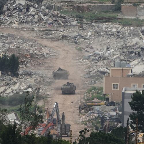 Israeli army vehicles and bulldozers operate in southern Lebanon, as seen from northern Israel, Wednesday, April 15, 2026. (AP Photo/Ariel Schalit)