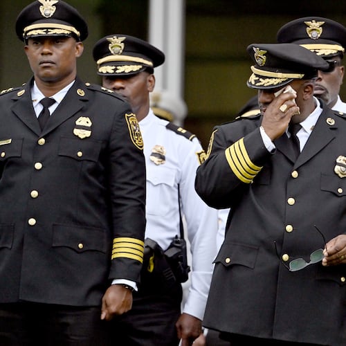 Members of various law enforcement agencies react during the Final Honors following the memorial service for DeKalb County police officer David Rose, who was killed while responding to the Aug. 8, 2025, shooting at the CDC, outside the First Baptist Church Atlanta, Friday, Aug. 22, 2025, in Atlanta. (Hyosub Shin/AJC)