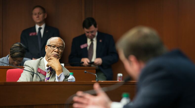 State Rep. Calvin Smyre, D-Columbus, left, looks on as Rep. Jay Roberts, R-Ocilla, right, presents a bill proposing to raise millions of dollars more to maintain Georgia's roads and bridges before the House Transportation committee, Thursday, Feb. 12, 2015, in Atlanta. In recent days, GOP leaders have sought to placate local government officials unhappy with their initial proposal to take about $500 million in local sales taxes on fuel for state use. (AP Photo/David Goldman) State Rep. Calvin Smyre, D-Columbus, left, looks on as Jay Roberts, R-Ocilla, right, chairman of the House Transportation Committee, presents a bill proposing to raise millions of dollars more to maintain Georgia's roads and bridges. AP/David Goldman