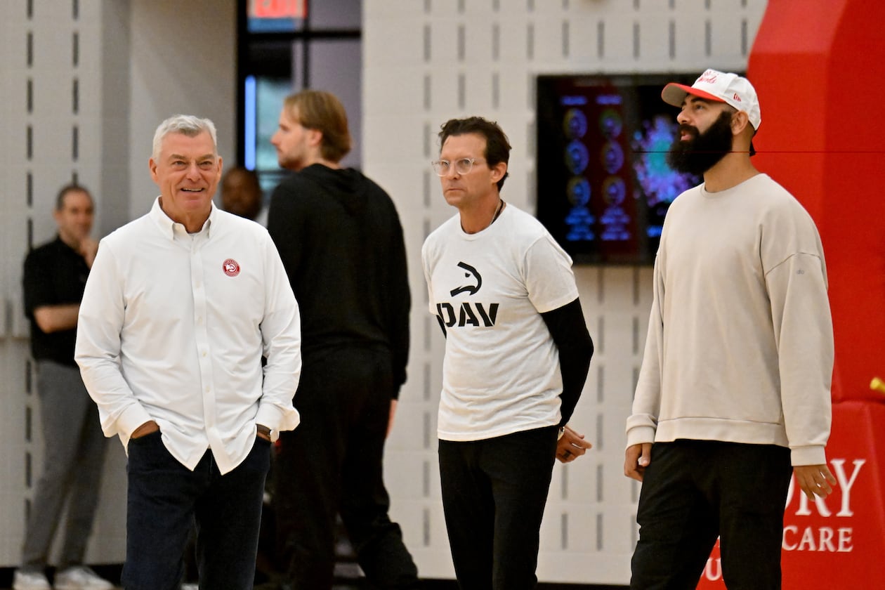 From left, principal owner Tony Ressler, coach Quin Snyder and general manager Onsi Saleh confer during the first day of Atlanta Hawks training camp at the team’s practice facility at the Emory Sports Medicine Complex, Tuesday, Sept. 30, 2025, in Atlanta. (Hyosub Shin/AJC)