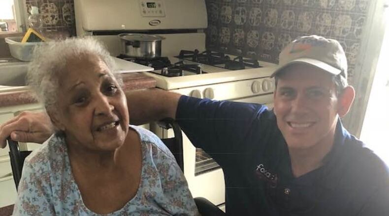 Based in Stone Mountain, Friends of Disabled Adults and Children (FODAC) President/CEO Chris Brand traveled to Puerto Rico to help people in need such as this lady who needed a wheelchair. FODAC will host its annual golf tournament at 8 a.m. Oct. 5 at Stone Mountain Park to raise more funds. (Courtesy of FODAC)