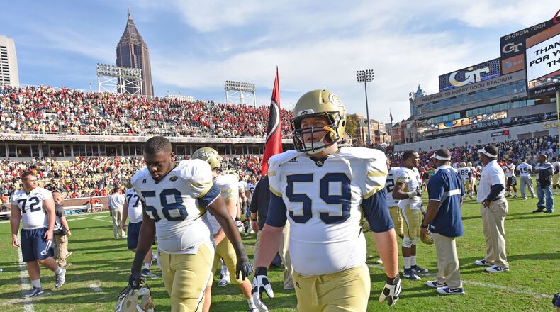 Georgia Tech Yellow Jackets offensive lineman Freddie Burden (58) and Georgia Tech Yellow Jackets offensive lineman Trey Smith (59) react after they lost over the Georgia Bulldogs at Bobby Dodd Stadium on Saturday, November 28, 2015.  HYOSUB SHIN / HSHIN@AJC.COM
