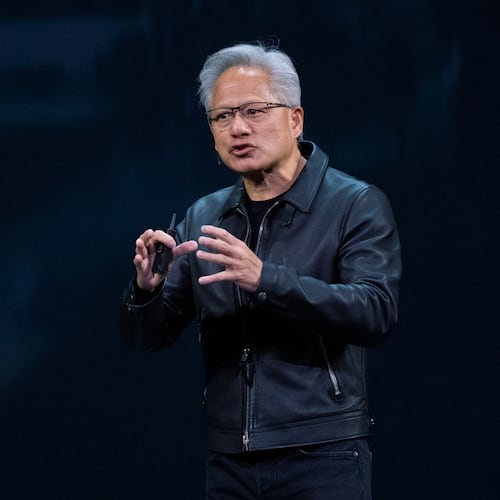 NVIDIA CEO Jensen Huang speaks on how AI infrastructure and AI factories that generate intelligence at scale are powering a new industrial revolution, at Washington Convention Center, Tuesday, Oct. 28, 2025, in Washington. (AP Photo/Manuel Balce Ceneta)