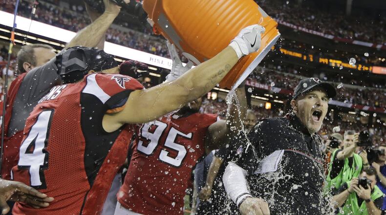 Atlanta Falcons coach Dan Quinn reacts as he is dunked after the NFC championship game against the Green Bay Packers Sunday, Jan. 22, 2017, in Atlanta. The Falcons won 44-21 to advance to Super Bowl LI. (AP Photo/Mark Humphrey)