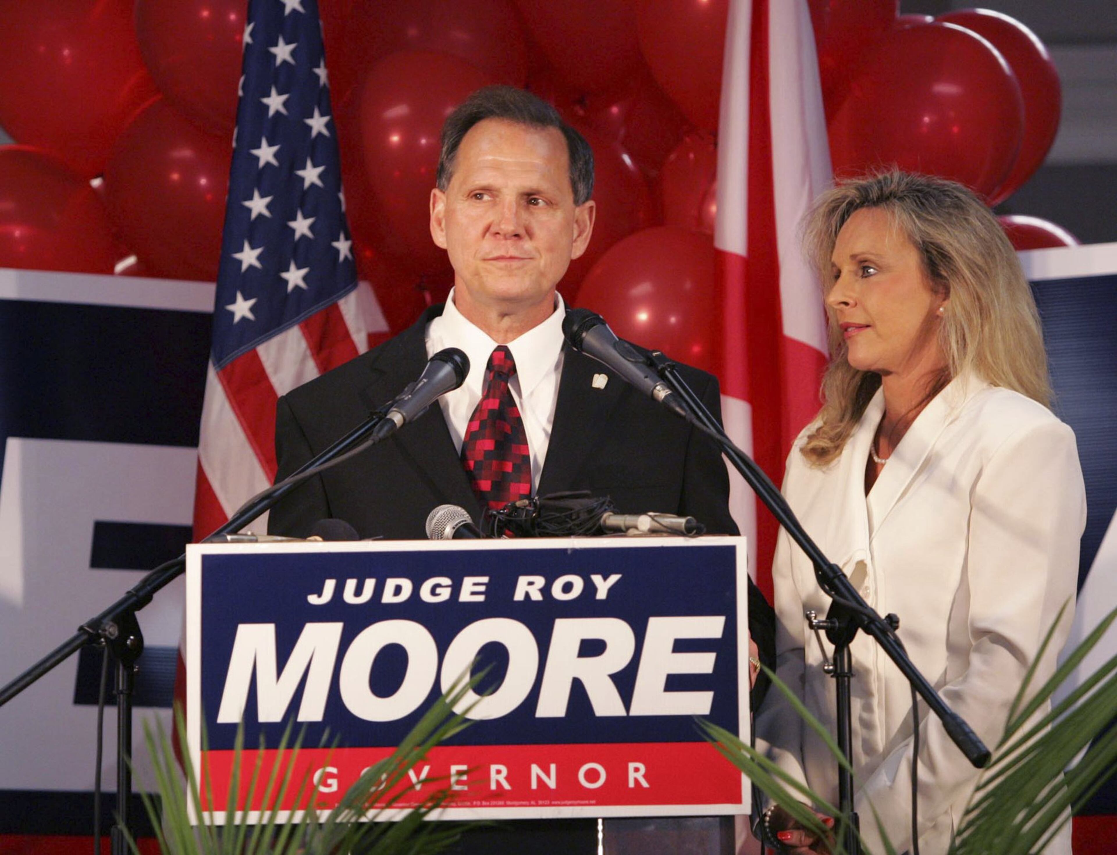 Brant Frost V, son of First Liberty Building & Loan owner Brant Frost IV, volunteered for the U.S. Senate campaign for former Alabama Chief Justice Roy Moore (center) in 2017. Moore also ran for Alabama governor in 2006. (Butch Dill/AP 2006)