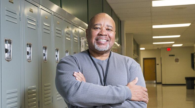 Retired Gwinnett County Police Major Jonathan ‘Keybo’ Taylor stands for a portrait at Collins Hill High School in Suwanee, Wednesday, February 13, 2019. Taylor often substitute teaches in at Gwinnett county schools in addition to coaching the 9th grade football team at Central Gwinnett High school. ALYSSA POINTER/ALYSSA.POINTER@AJC.COM
