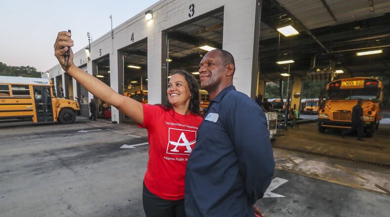 Atlanta Public Schools Superintendent Dr. Meria J. Carstarphen, taking a selfie on the first day of school in August with fleet technician Alfonzo Roberson. JOHN SPINK/JSPINK@AJC.COM