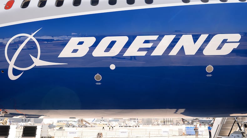 (FILES) This file photo taken on June 18, 2017 shows the Boeing logo on the fuselage of a Boeing 787-10 Dreamliner test plane presented on the Tarmac of Le Bourget. Emirates Airlines on November 12, 2017, agreed to purchase 40 Boeing 787-10 Dreamliners for $15.1 billion, its chief Sheikh Ahmed bin Saeed Al-Maktoum said at the opening of the Dubai Air Show. / AFP PHOTO / ERIC PIERMONTERIC PIERMONT/AFP/Getty Images ORIG FILE ID: AFP_U74PE