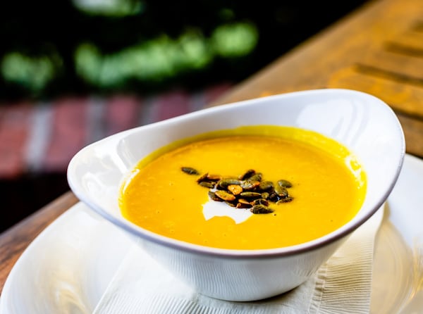 Butternut squash soup from Canoe is garnished with sweet and spicy pumpkin seeds. CONTRIBUTED BY HENRI HOLLIS