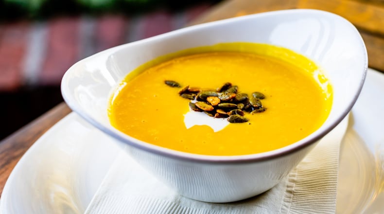 Butternut squash soup from Canoe is garnished with sweet and spicy pumpkin seeds. CONTRIBUTED BY HENRI HOLLIS